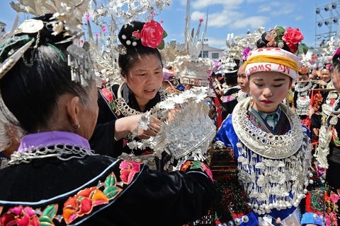 Miao girls in traditional costume at Sisters' Meal festival