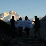 Sales team at Mt Everest base camp by sunset