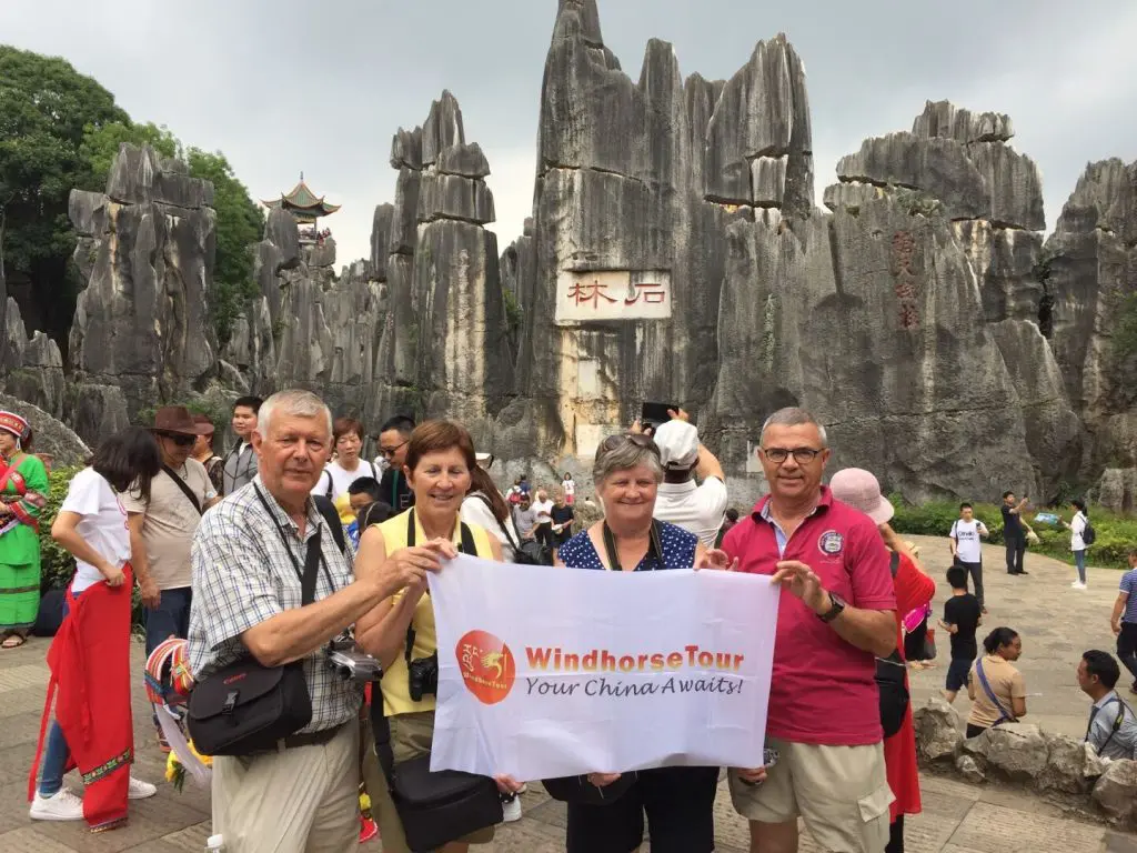 WindhorseTour travelers visiting the Stone Forest in their Yunnan tour, one of China’s top natural attractions