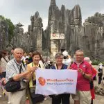 WindhorseTour travelers visiting the Stone Forest in their Yunnan tour, one of China’s top natural attractions