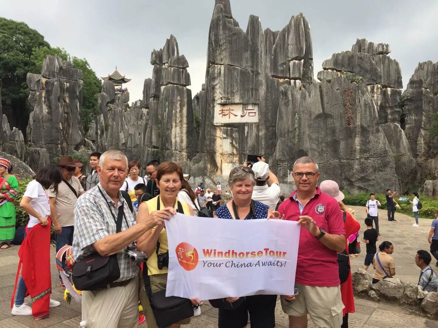 WindhorseTour travelers visiting the Stone Forest in their Yunnan tour, one of China’s top natural attractions