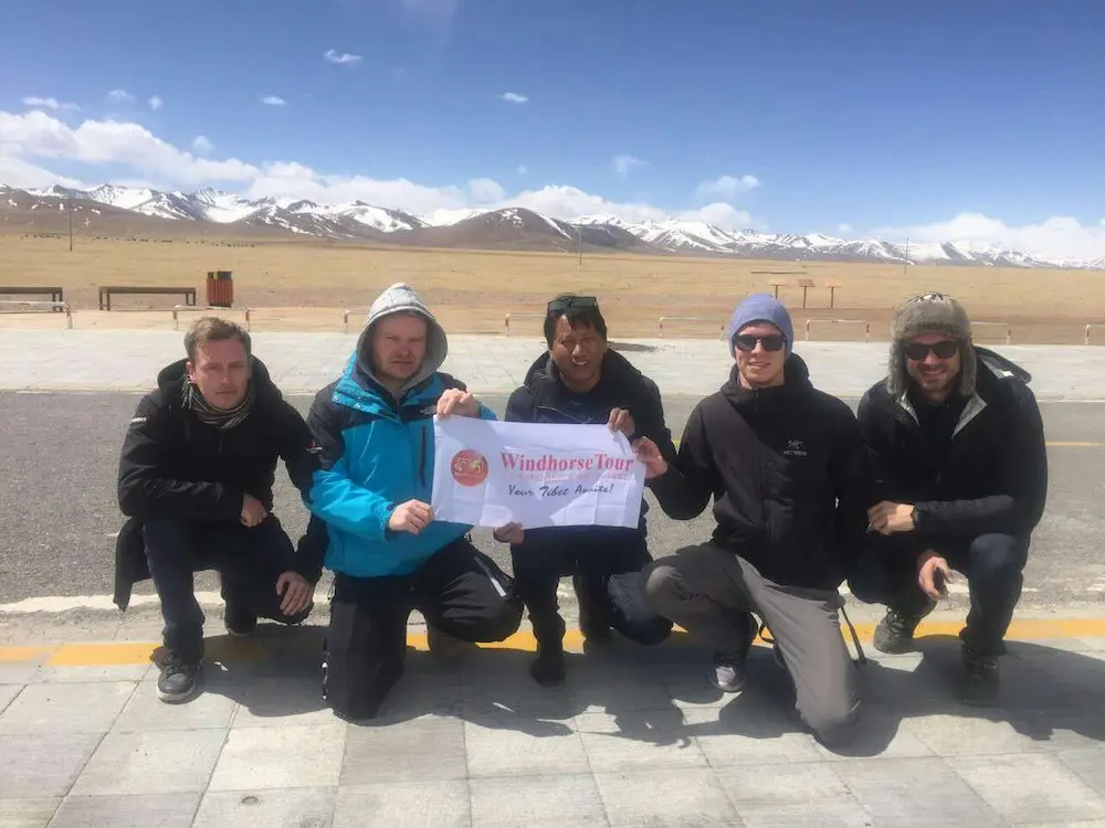 tibet tour guide Tenzin with travelers in winter season