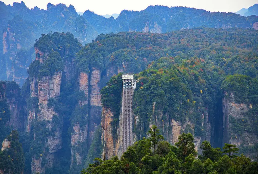 The Bailong Elevator in Zhangjiajie National Forest Park, a glass lift built along sandstone cliffs offering stunning views of the Wulingyuan Scenic Area in China