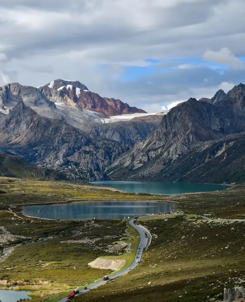 Sister Lakes near Batang on the Sichuan–Tibet Highway (G318), reflecting snow peaks and alpine scenery