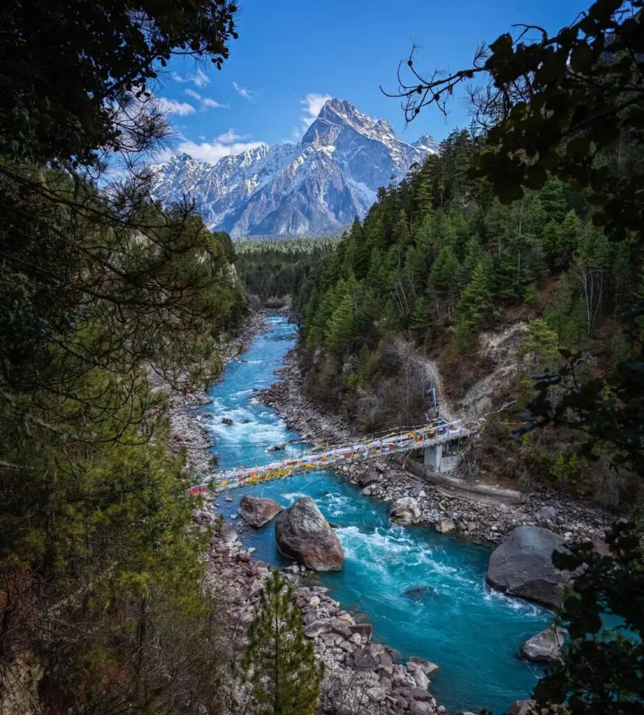 Driving through the Parlung Tsangpo Valley between Ranwu and Bomi on the Sichuan–Tibet Highway (G318), surrounded by forests, rivers, and snow peaks