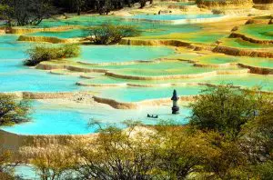 Colorful terraced pools at Huanglong National Park in Sichuan, visited on the 3 Day Jiuzhaigou Train Tour from Chengdu