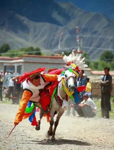 Khampa horsemen racing at the Litang Horse Racing Festival in Sichuan, Kham Tibetan region of China